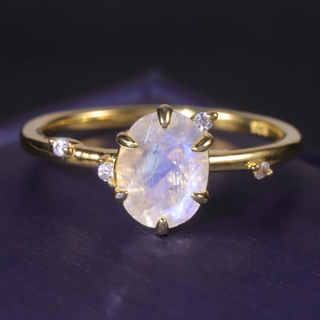 Oval moonstone ring on a fine gold-tone band
