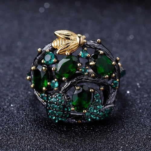 Chrome diopside ring on a dark ground