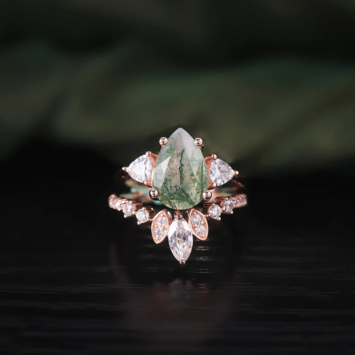 Moss agate pear ring set worn on the hand