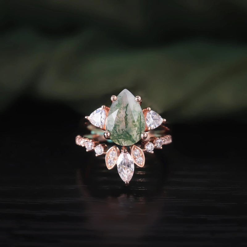 Moss agate pear ring set worn on the hand
