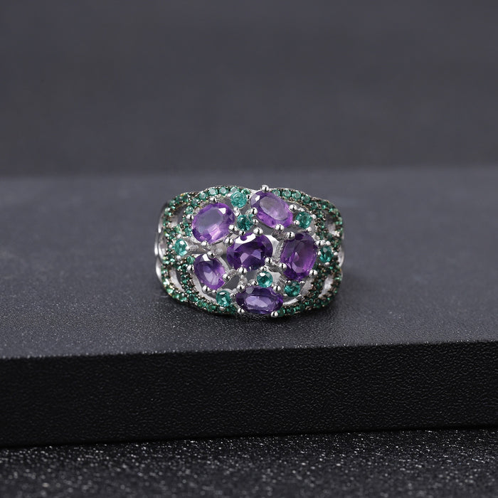Amethyst ring with green accent stones in sterling silver